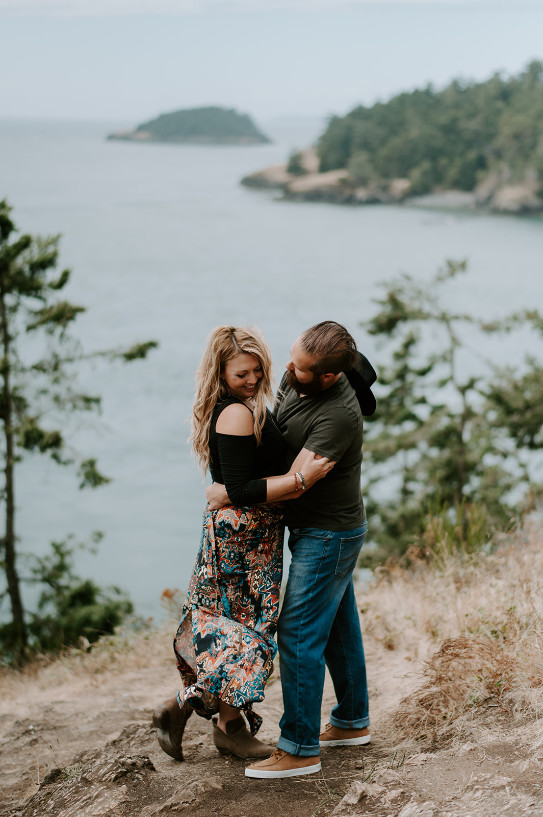 Couple embracing at the Deception Pass overlook.