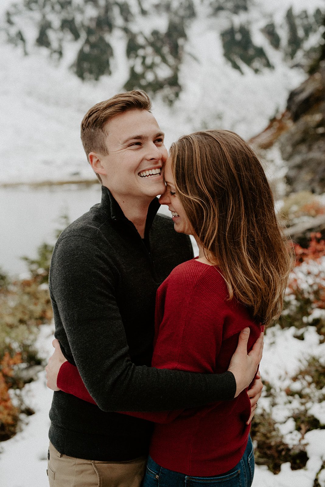 beautiful engagement couple holding each other and smiling big