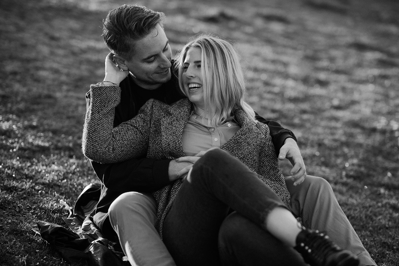Black and white portrait of a couple laughing together during a Seattle engagement session