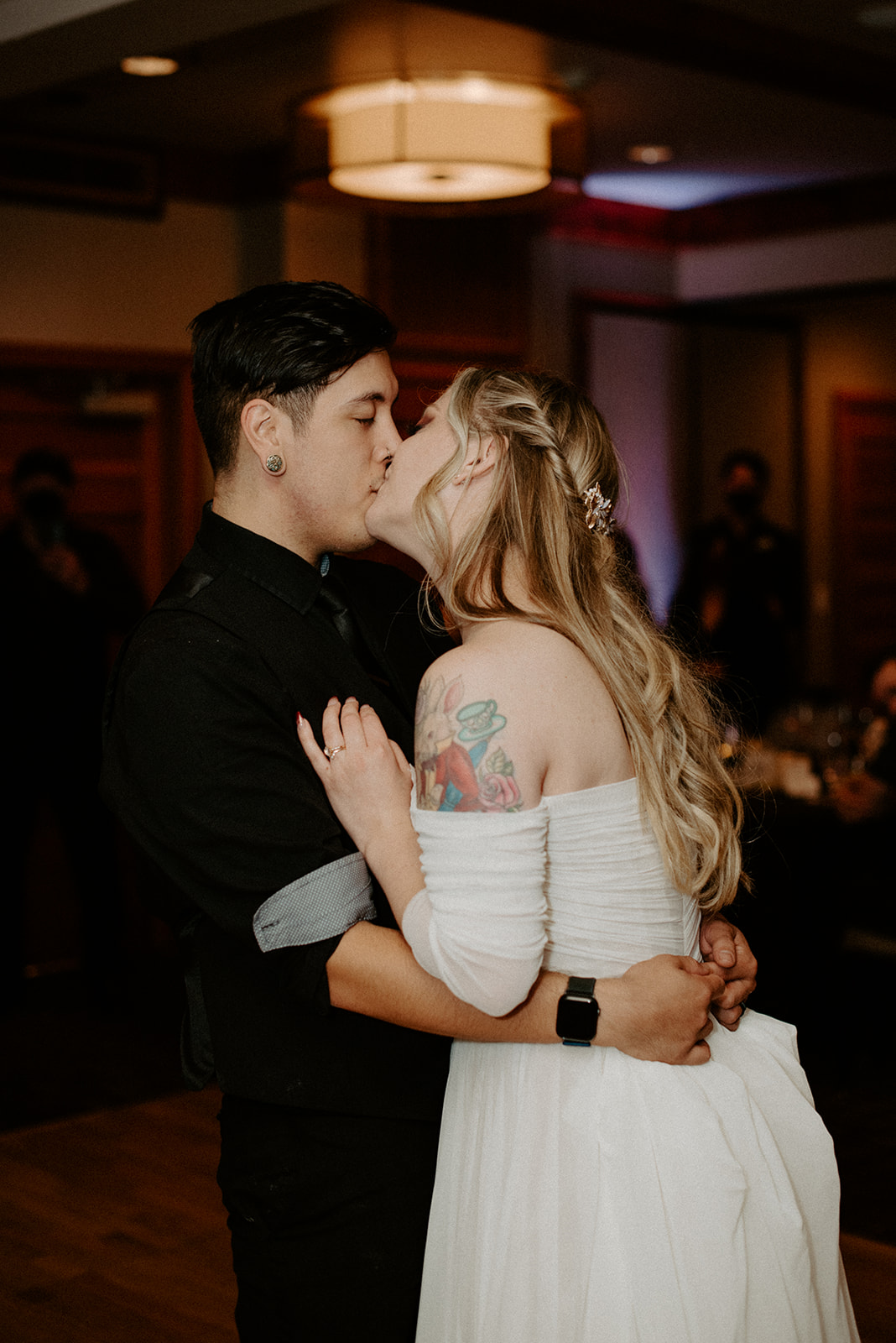 Bride and groom sharing a kiss during their first dance at the Willows Lodge wedding reception
