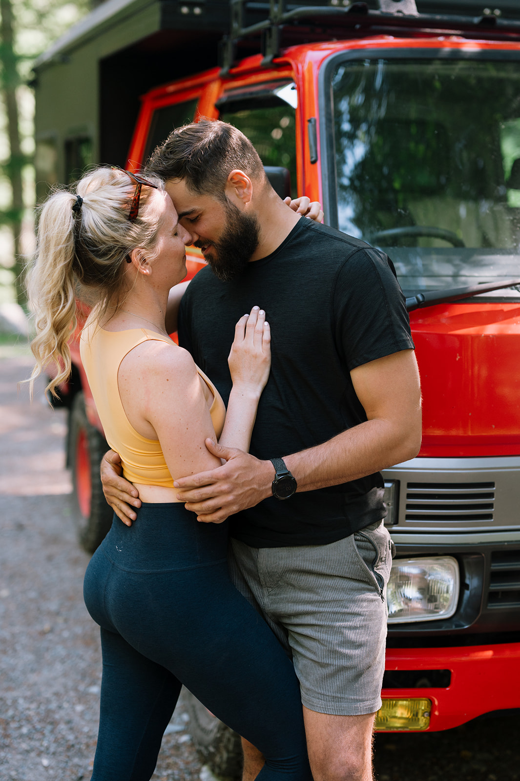 R and M sharing a close moment in front of their retrofitted fire truck.