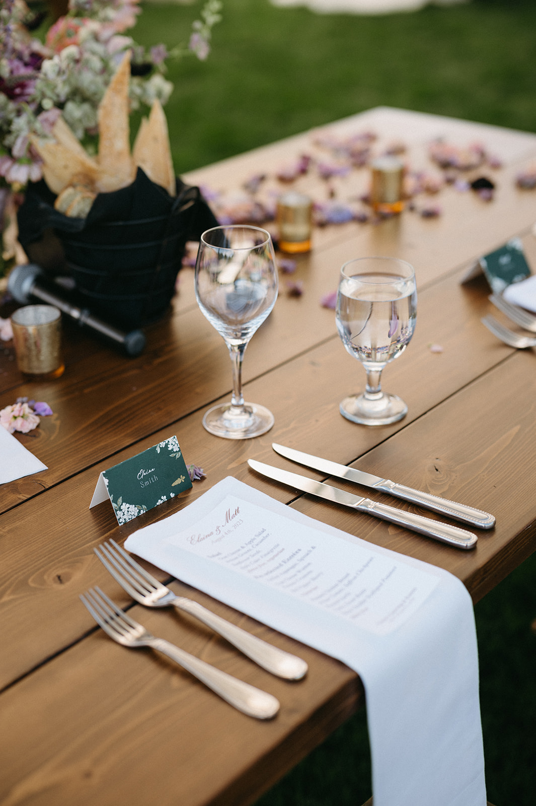 Place setting with personalized menu and name card at reception table