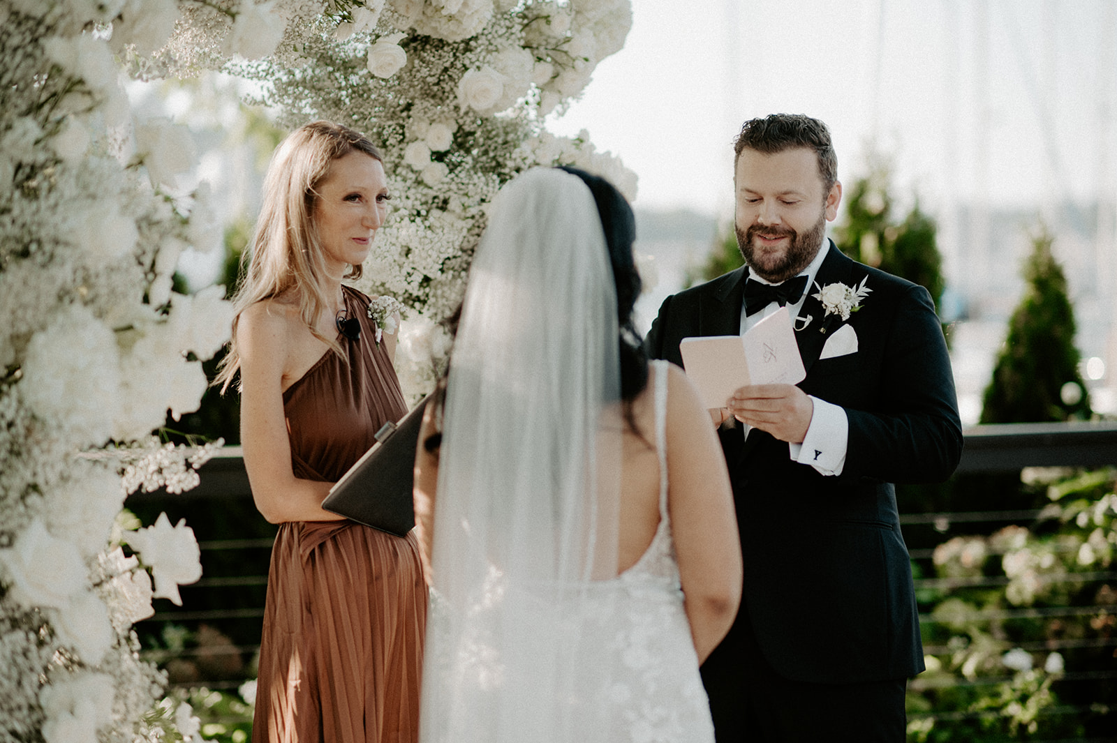 Groom reading his vows to the bride during their Dockside at Duke’s wedding ceremony.