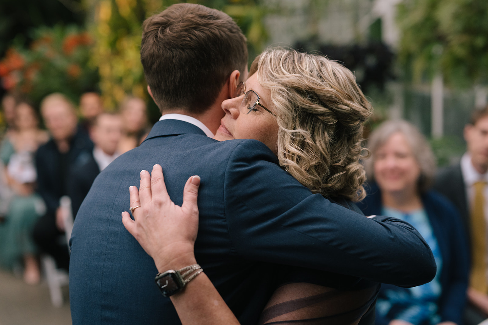 Patrick hugging his mother warmly during the wedding ceremony.