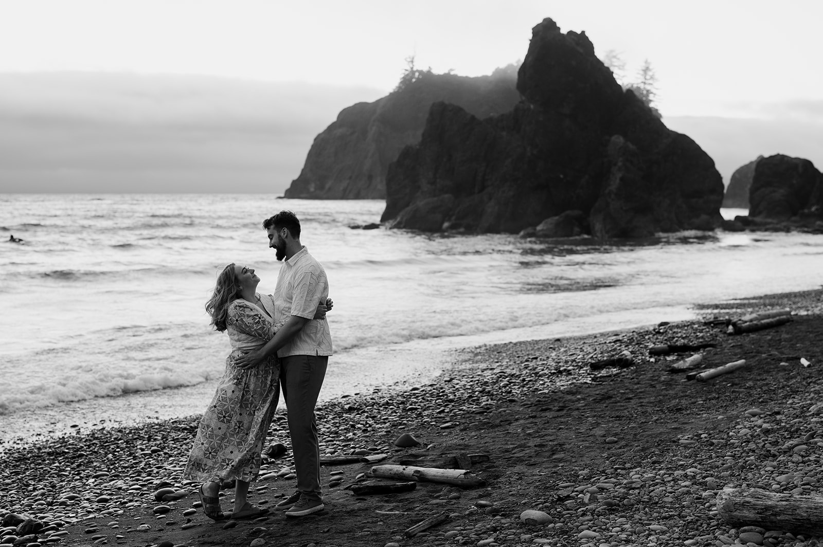 Black and white engagement photos at Ruby Beach in Olympic National Park