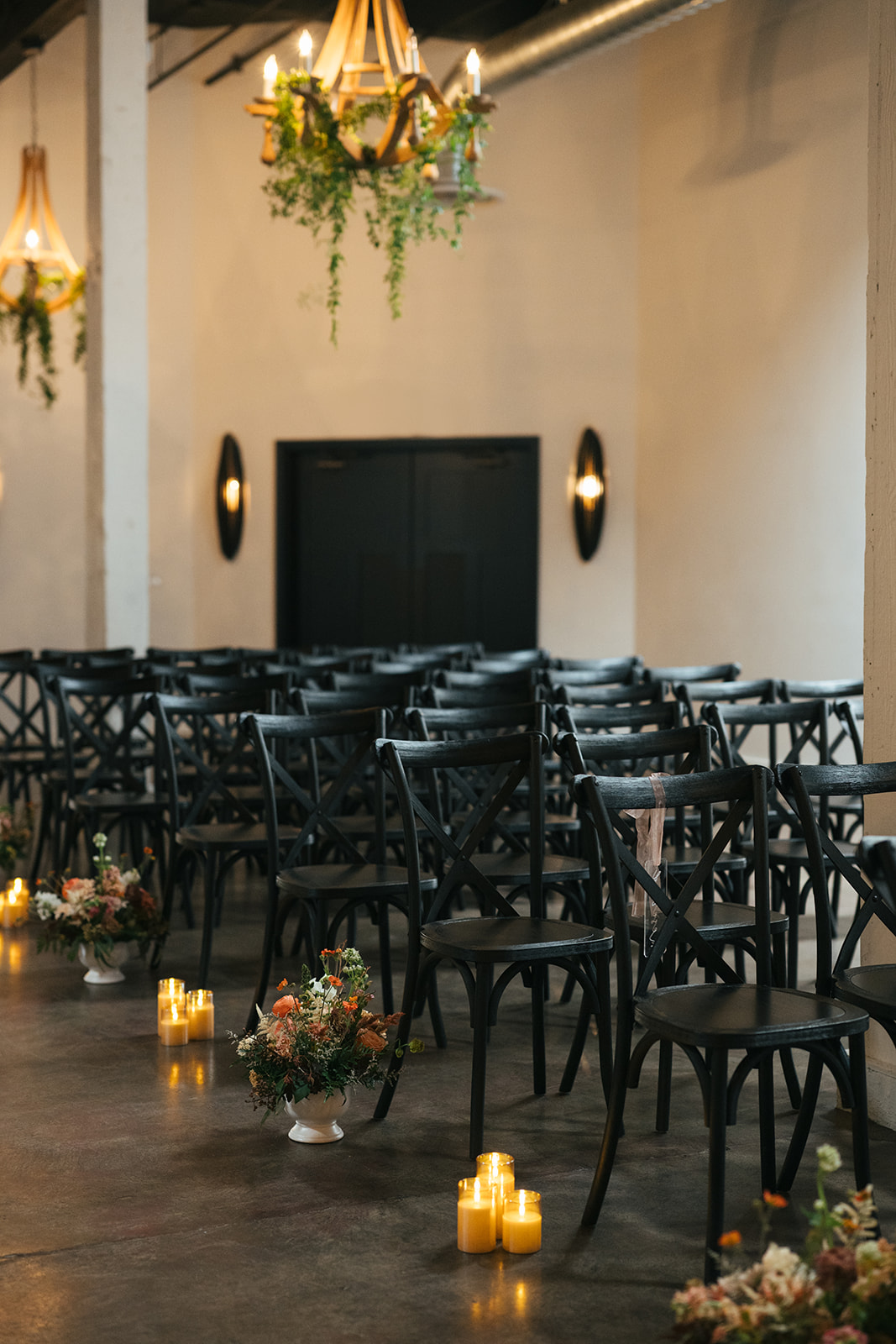 Indoor wedding ceremony details at Hideaway Cellars with floral-lined aisle