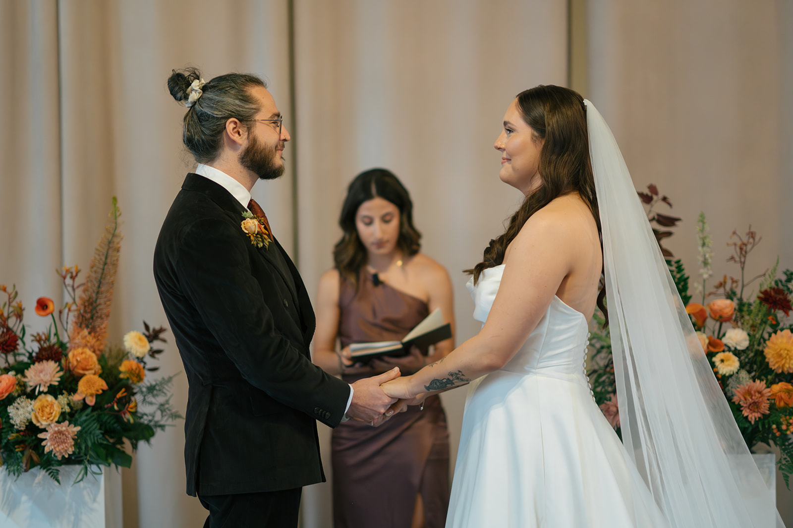 Couple exchanging vows during Hideaway Cellars wedding ceremony