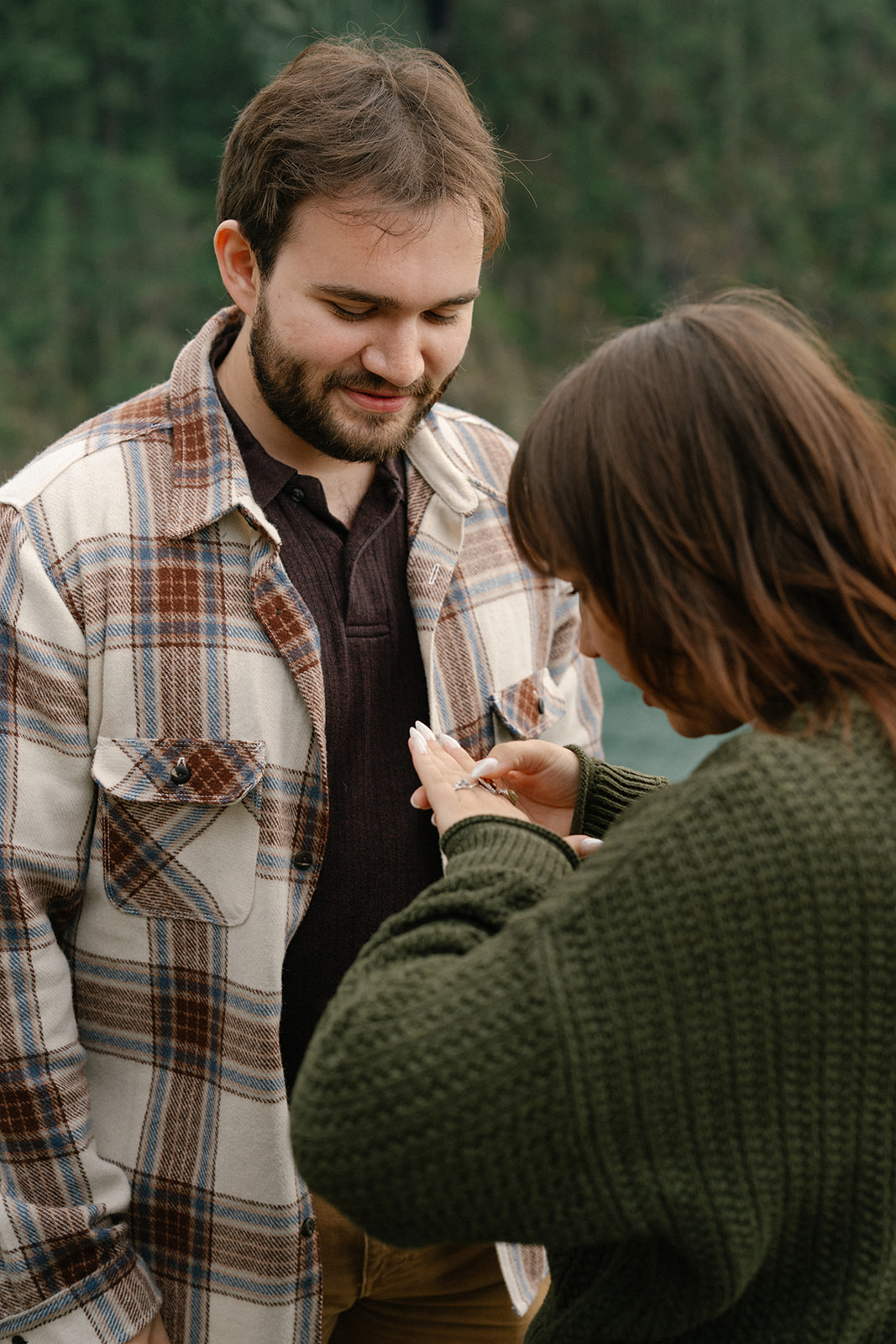 Ashley looks down at her new engagement ring with a smile.