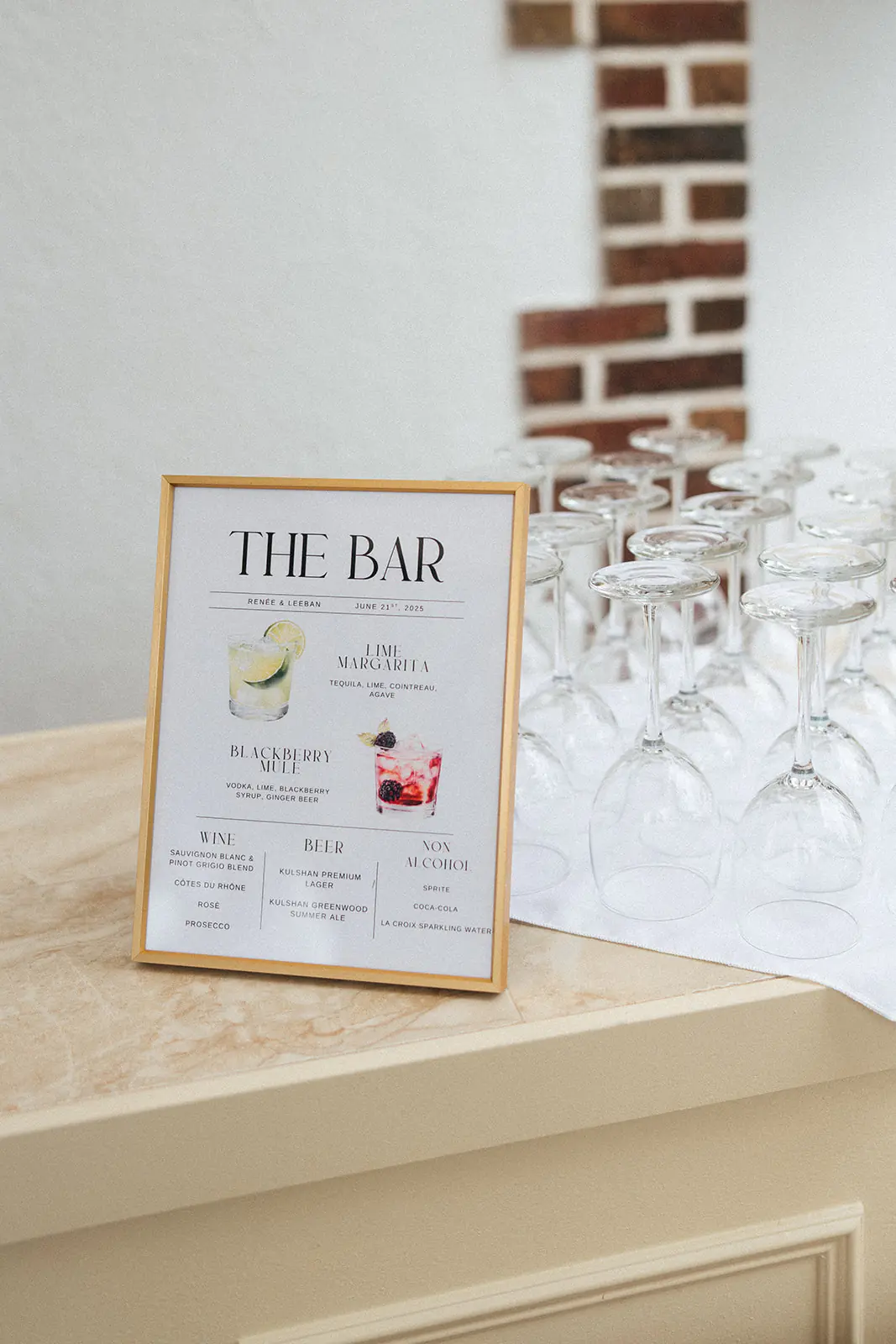 Wedding bar menu with glassware arranged for guests