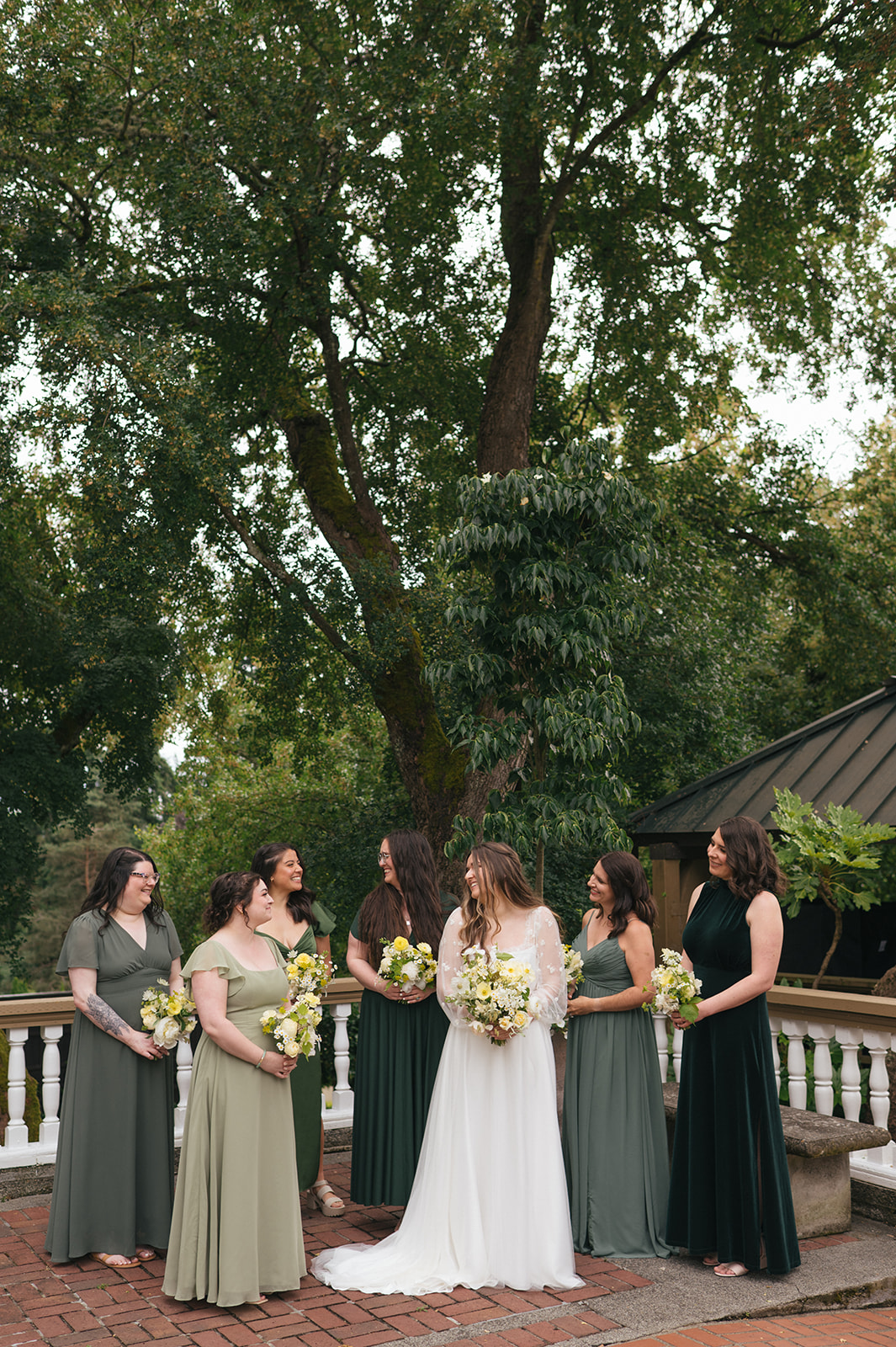 Bridesmaids holding bouquets and laughing together before ceremony at Lairmont Manor