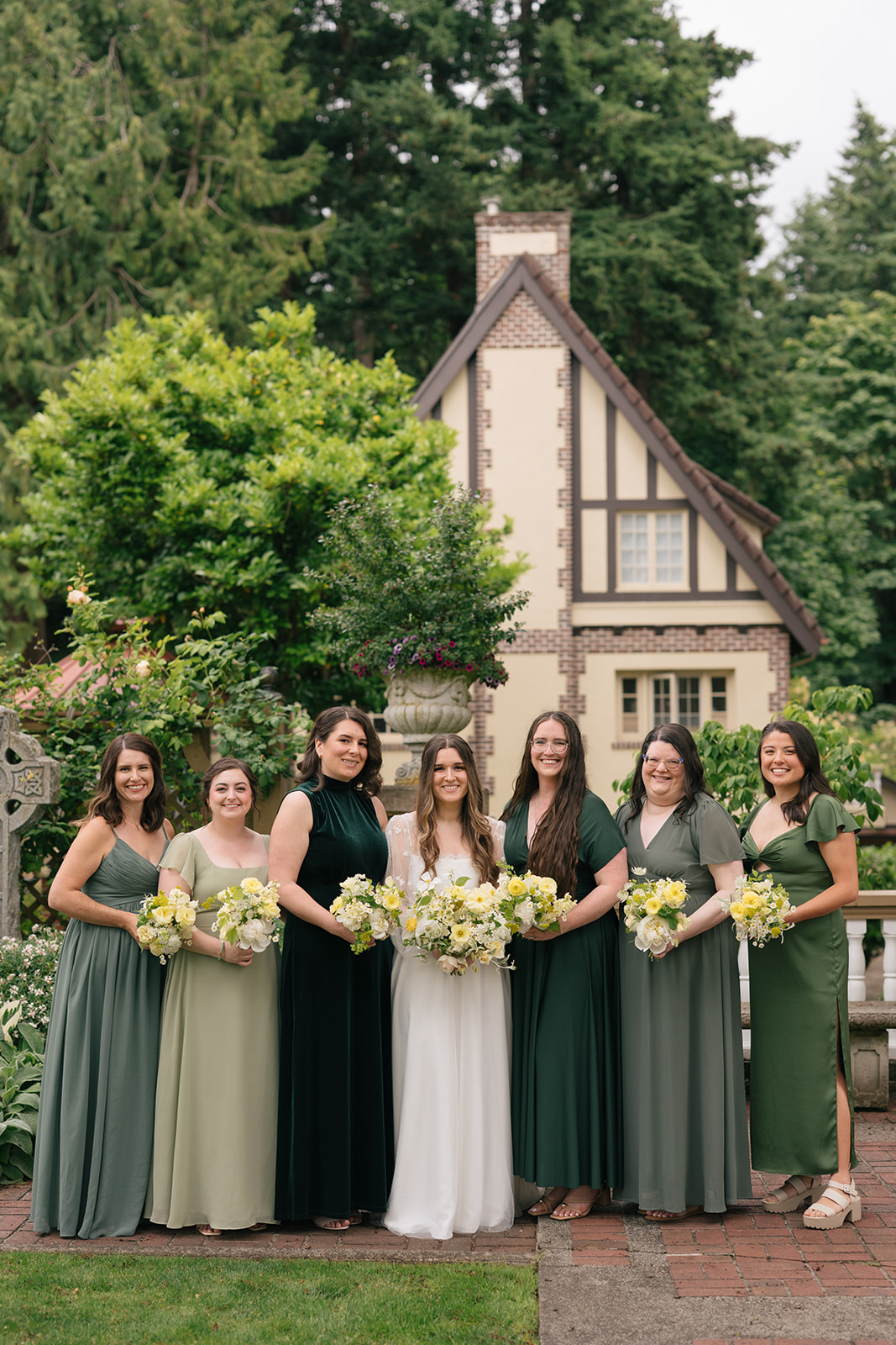 Bridal party lined up with bouquets in garden setting at Lairmont Manor wedding