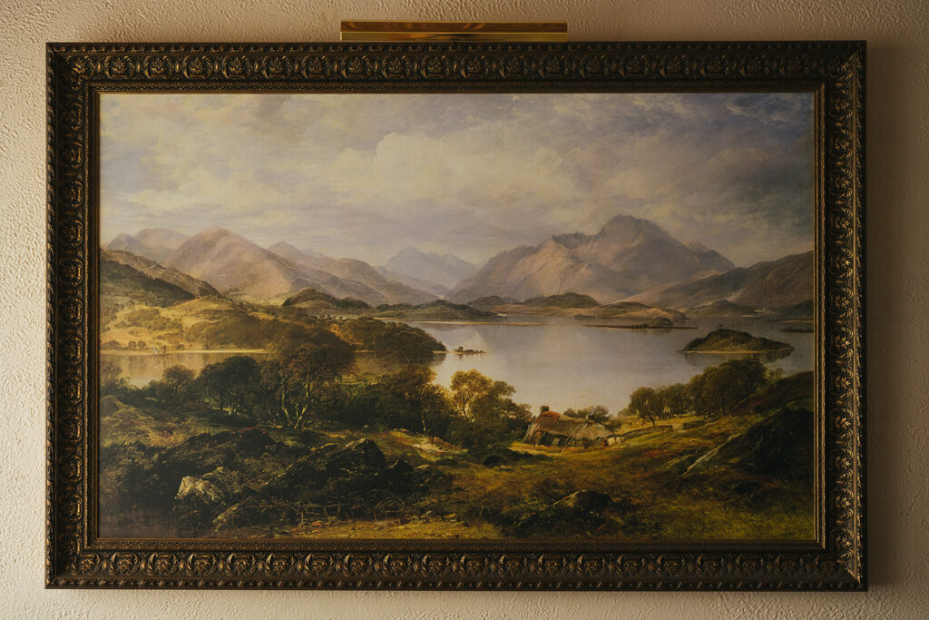Framed landscape painting inside historic Lairmont Manor
