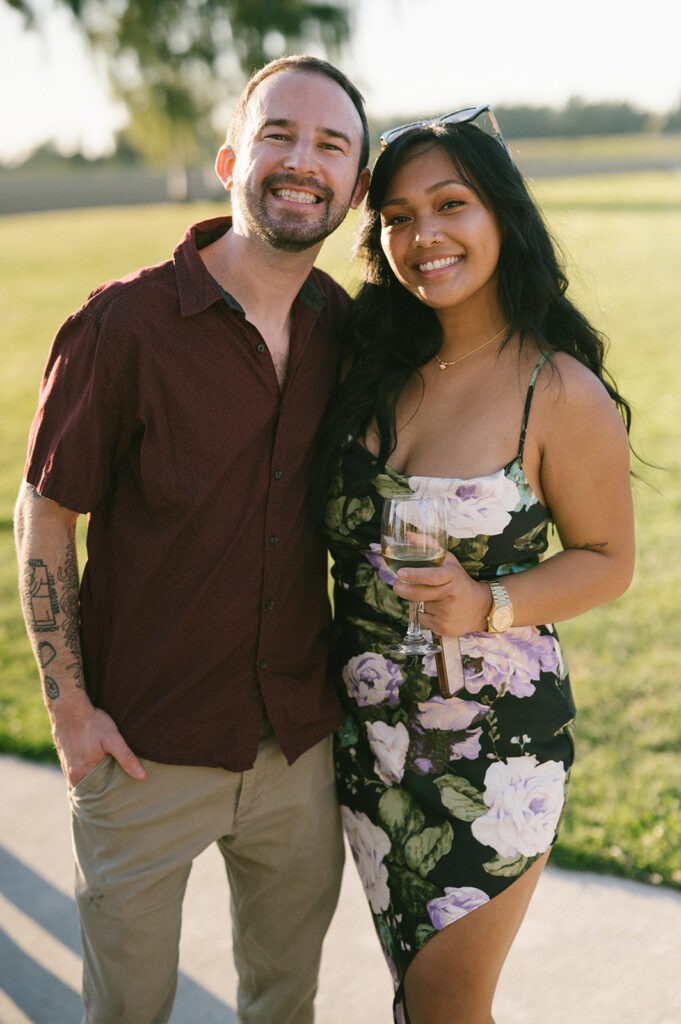 Two guests smile for a photo at this Saltbox Barn wedding reception