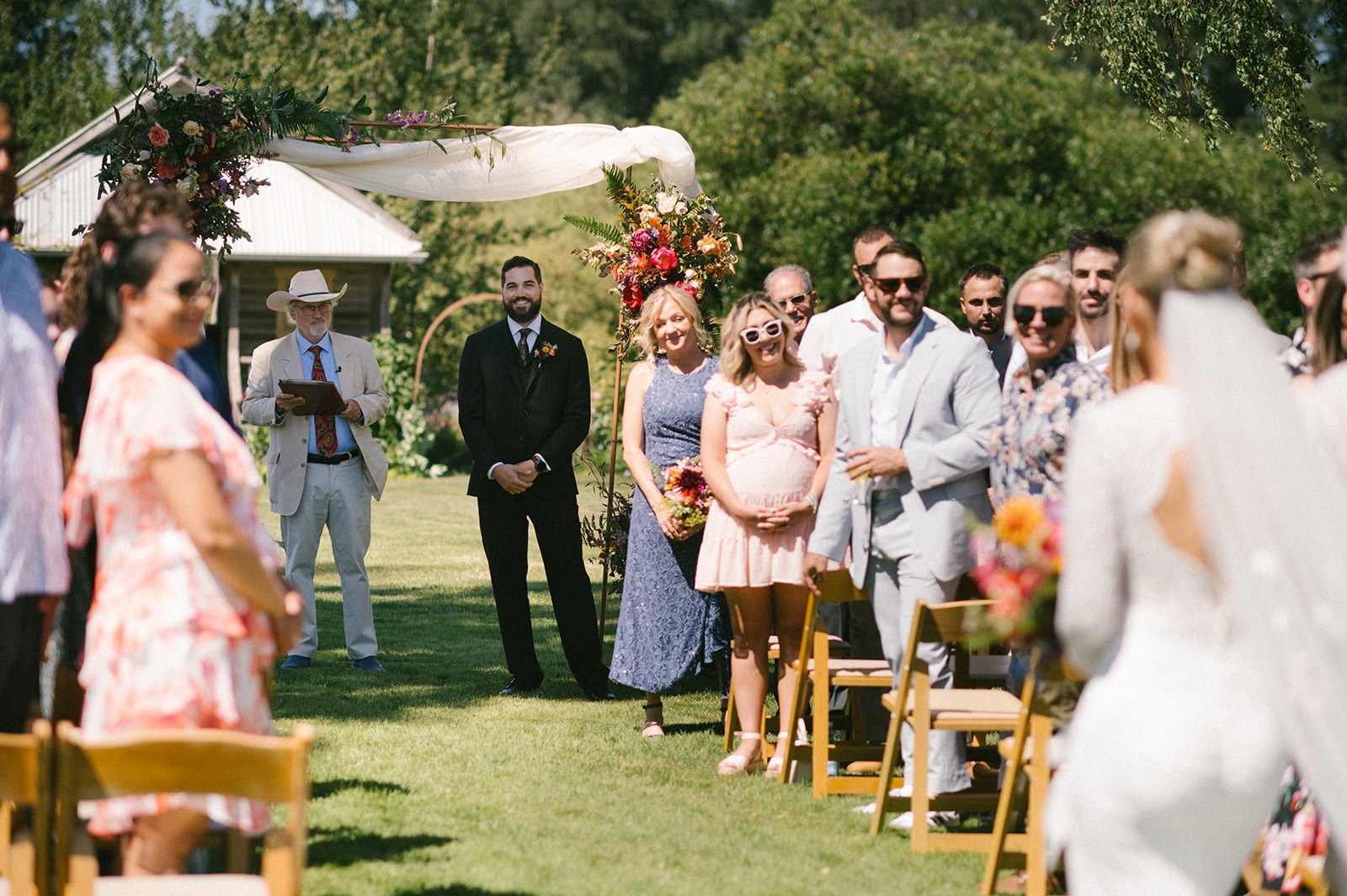 Watch this groom's reaction as his bride approaches during this Saltbox Barn wedding ceremony. Reach out to capture your own first look.