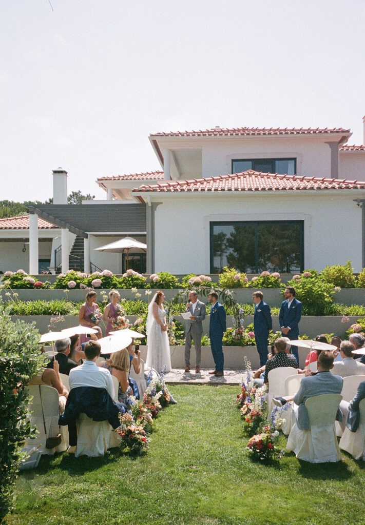 destination wedding ceremony at a Mediterranean villa with a tiered garden altar