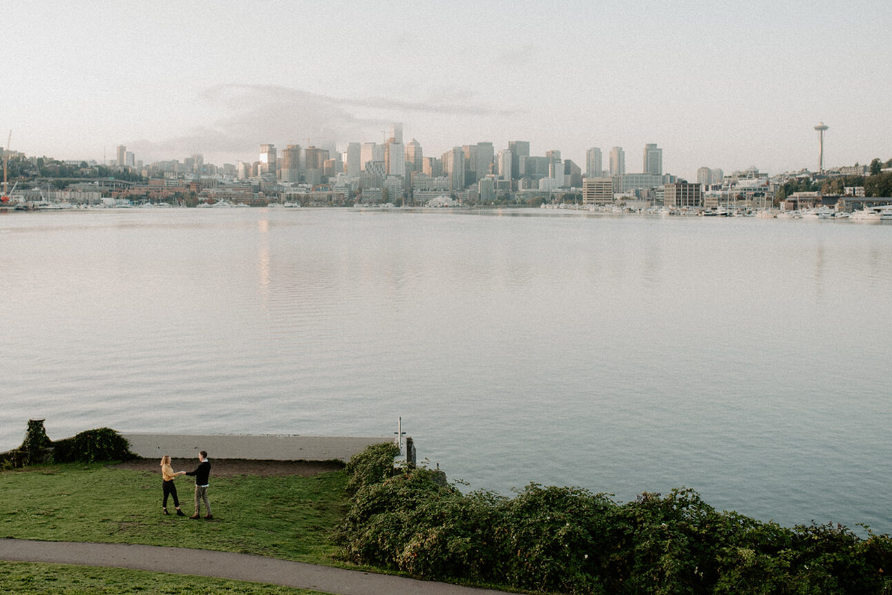 Wide view of Seattle skyline across Lake Union during a Gas Works Park engagement session