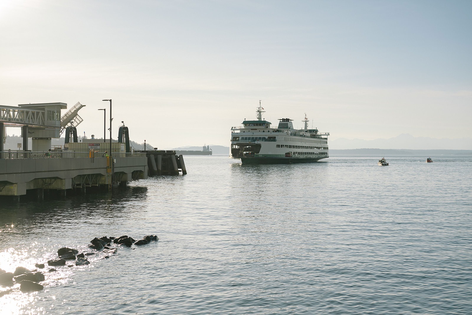 Washington State Ferry approaching the Seattle waterfront on a clear evening