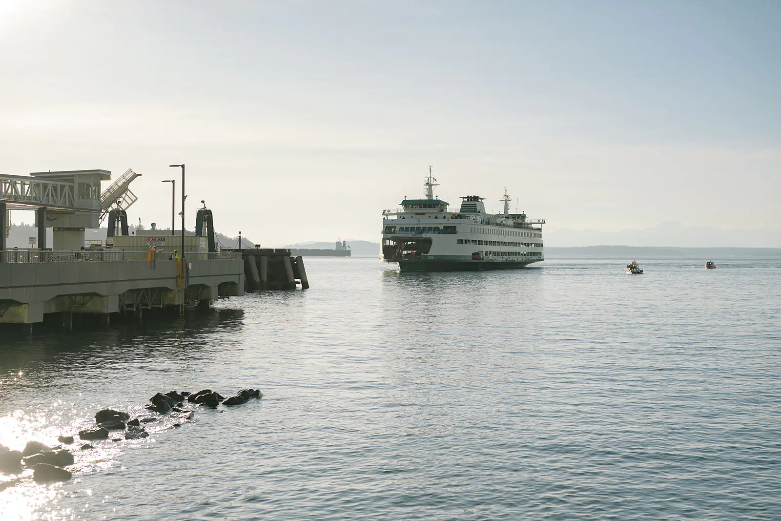 Washington State Ferry approaching the Seattle waterfront on a clear evening