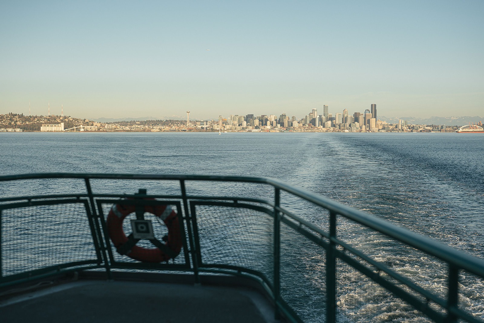 View from the back of a Washington State Ferry with the Seattle skyline across the water