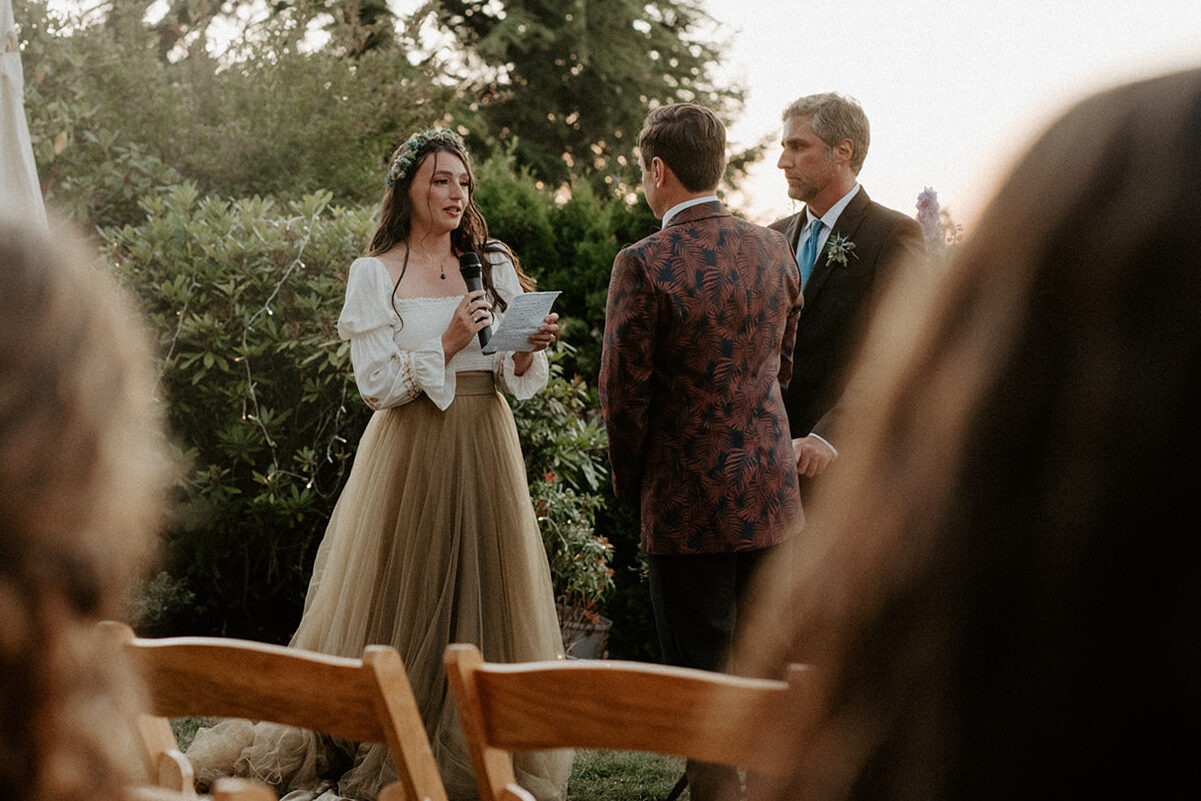 A bride reading personalized vows during a non-traditional wedding ceremony