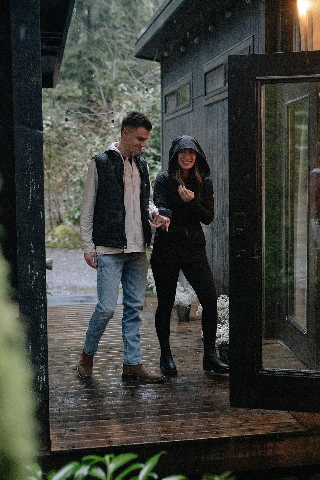 Bride-to-be smiles as she arrives at the candlelit cabin for her surprise proposal at Canyon Creek Cabins