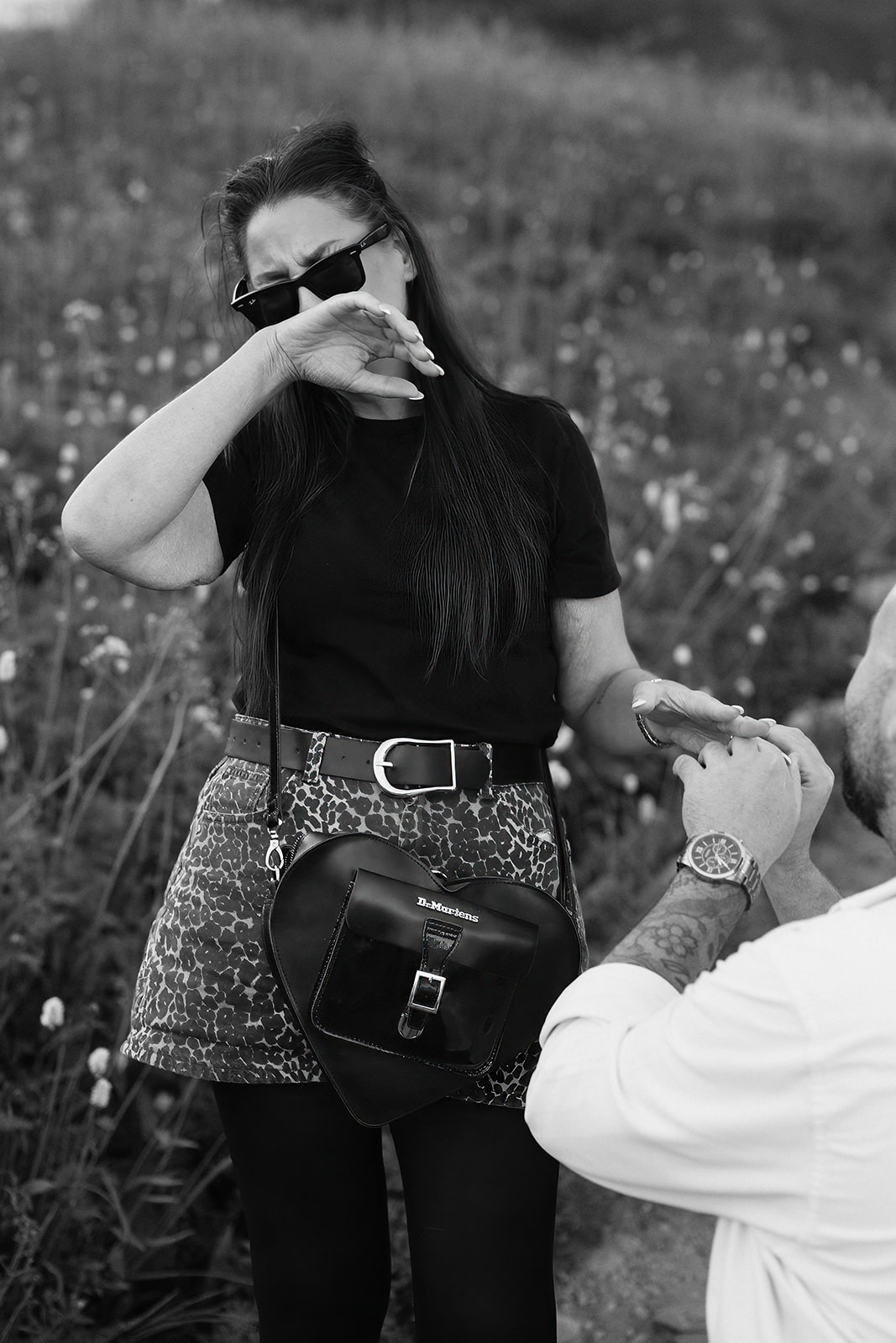 Bride-to-be wipes tears of joy after her surprise Mount Rainier proposal at Paradise