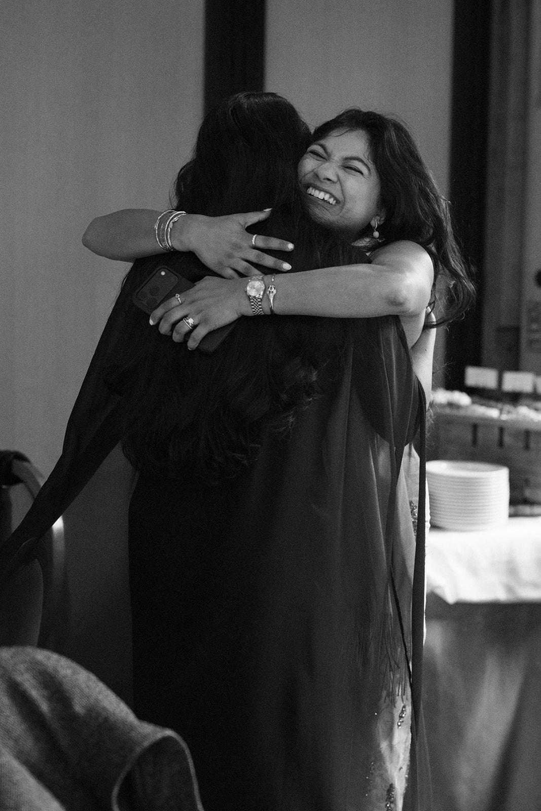 Priyanka hugs a close friend after her surprise proposal reveal at Willows Lodge in Woodinville, WA