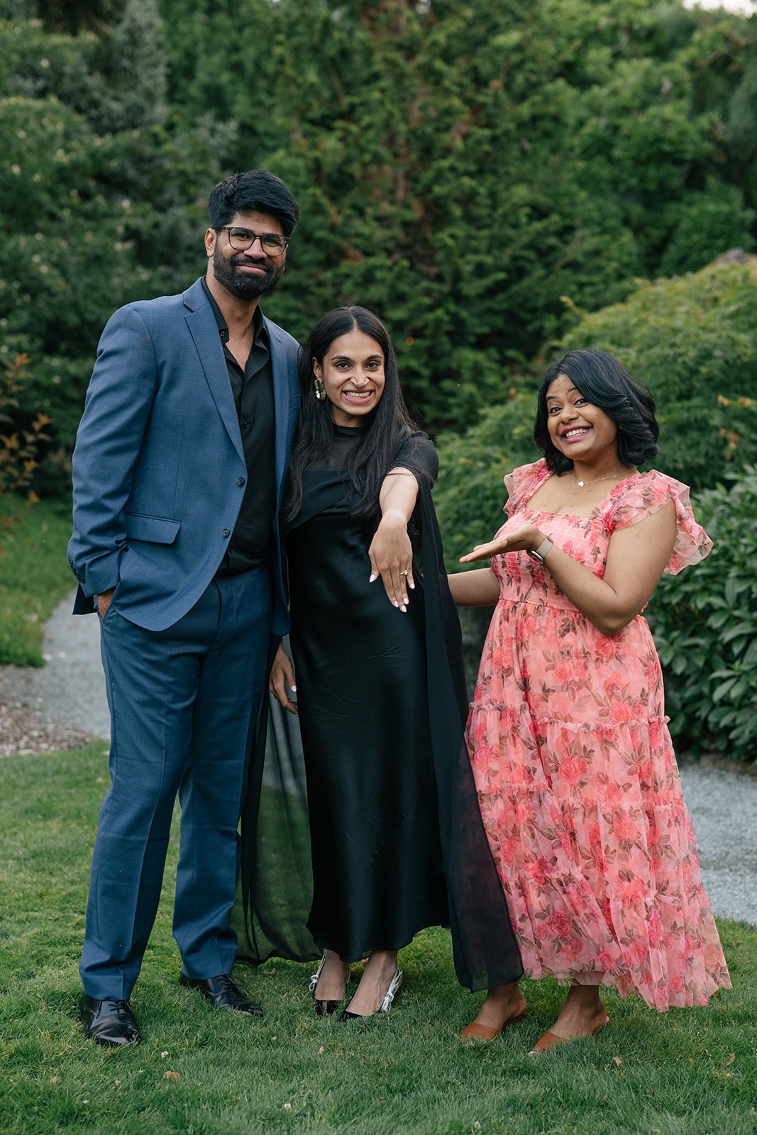 Piyush and Priyanka pose with a friend showing off the new engagement ring at Willows Lodge in Woodinville
