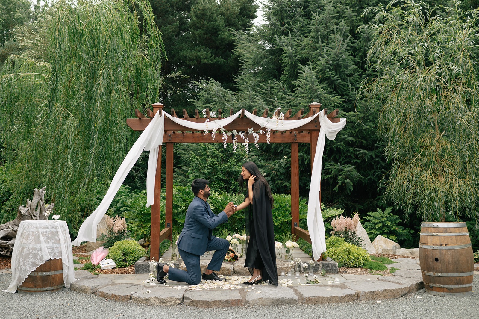 Piyush proposes to Priyanka beneath the floral proposal arch at Willows Lodge in Woodinville, Washington
